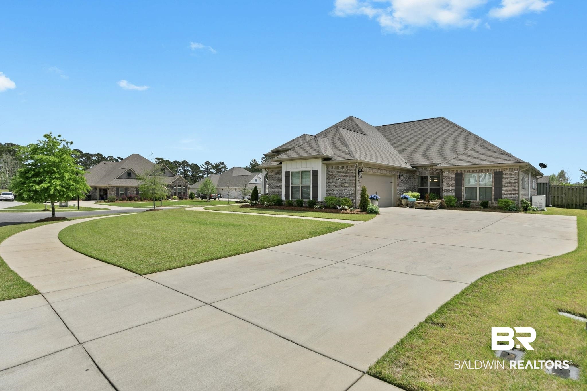 291 Hemlock Drive Fairhope, AL 36532 - Photo 5 of 65 French country style house featuring a front lawn, roof with shingles, driveway, and a garage