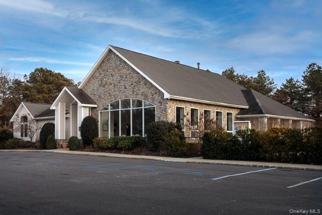 1000 Saddle Rock Road, Unit 2806 Holbrook, NY 11741 - Photo 2 of 3 front view of a house with a street