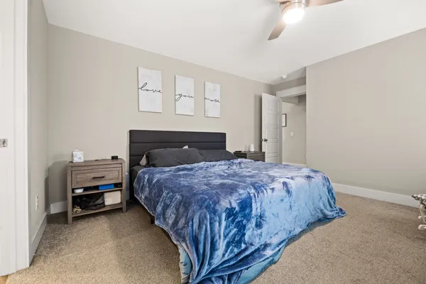 a bedroom with a bed and window