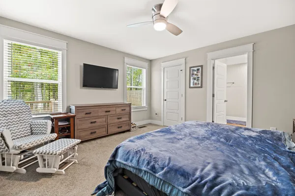 a bedroom with a bed and furniture