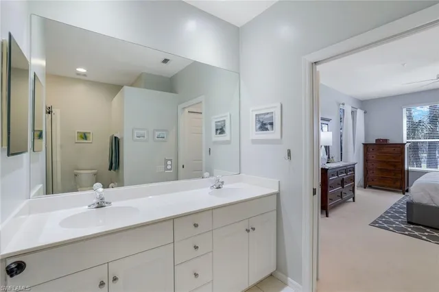 a bathroom with a double vanity sink double mirror and a