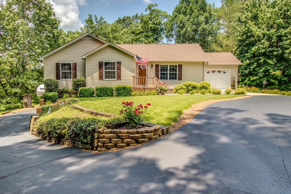1397 Back Bone Road Sparta, TN 38583 - Photo 1 of 30 a view of a house with a yard and potted plants