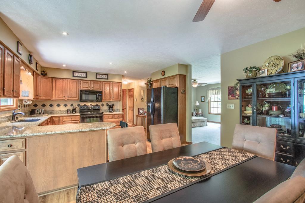 1397 Back Bone Road Sparta, TN 38583 - Photo 12 of 30 a large living room with stainless steel appliances furniture a rug and a view of kitchen