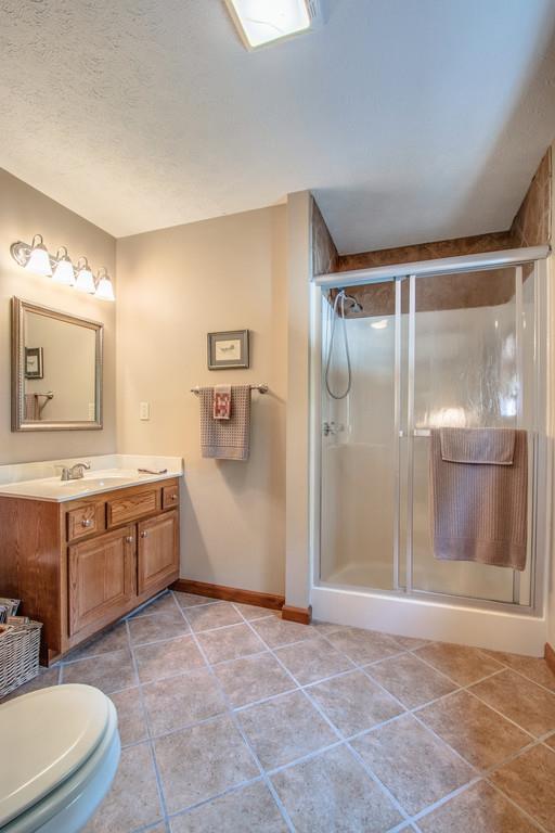 1397 Back Bone Road Sparta, TN 38583 - Photo 21 of 30 a bathroom with a tub sink and mirror