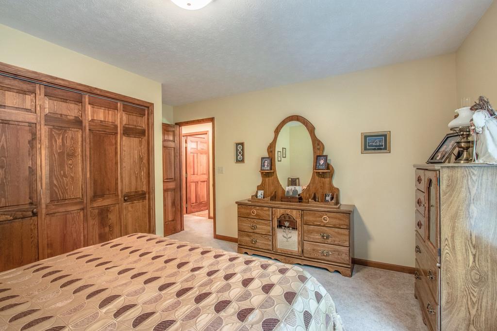 1397 Back Bone Road Sparta, TN 38583 - Photo 23 of 30 a bedroom with a bed and a dresser