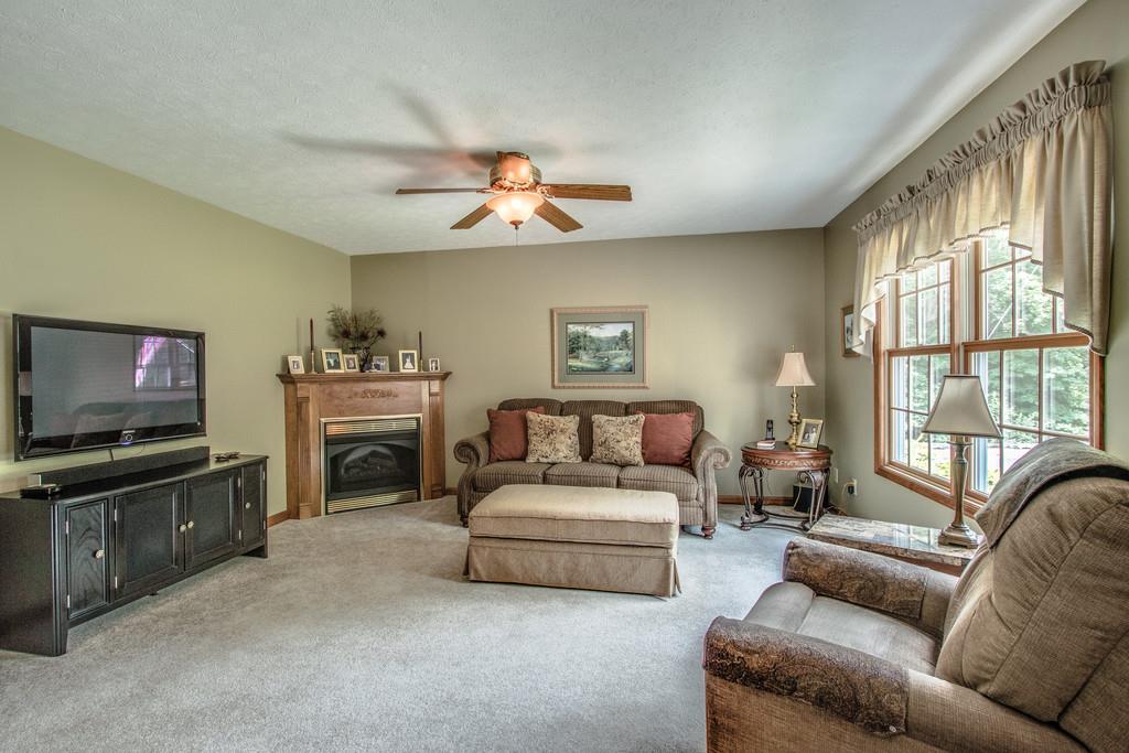 1397 Back Bone Road Sparta, TN 38583 - Photo 6 of 30 a living room with furniture a flat screen tv and a fireplace