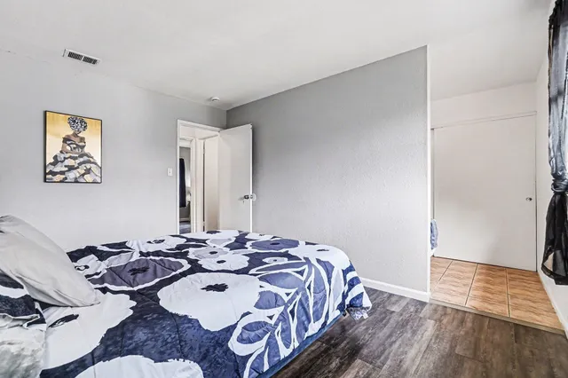 a bed room with a bed and a table