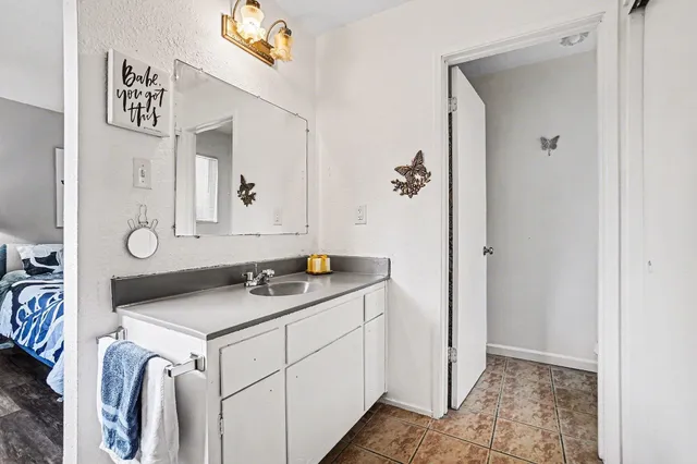 a utility room with cabinets washer and dryer