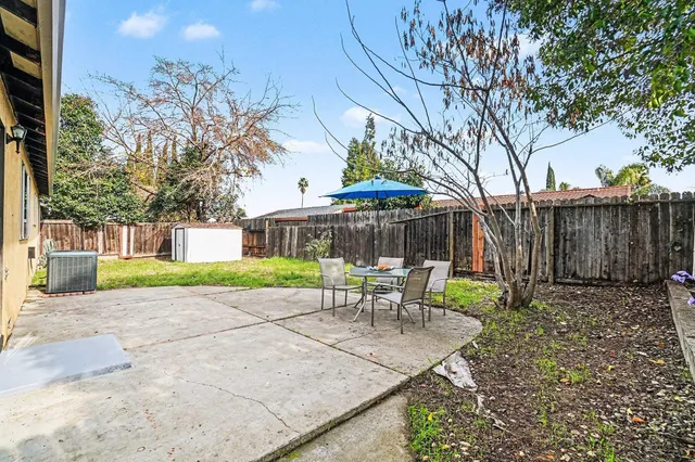 a view of a bench in a backyard