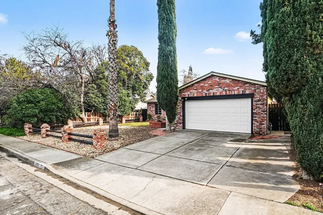 a front view of a building with garden