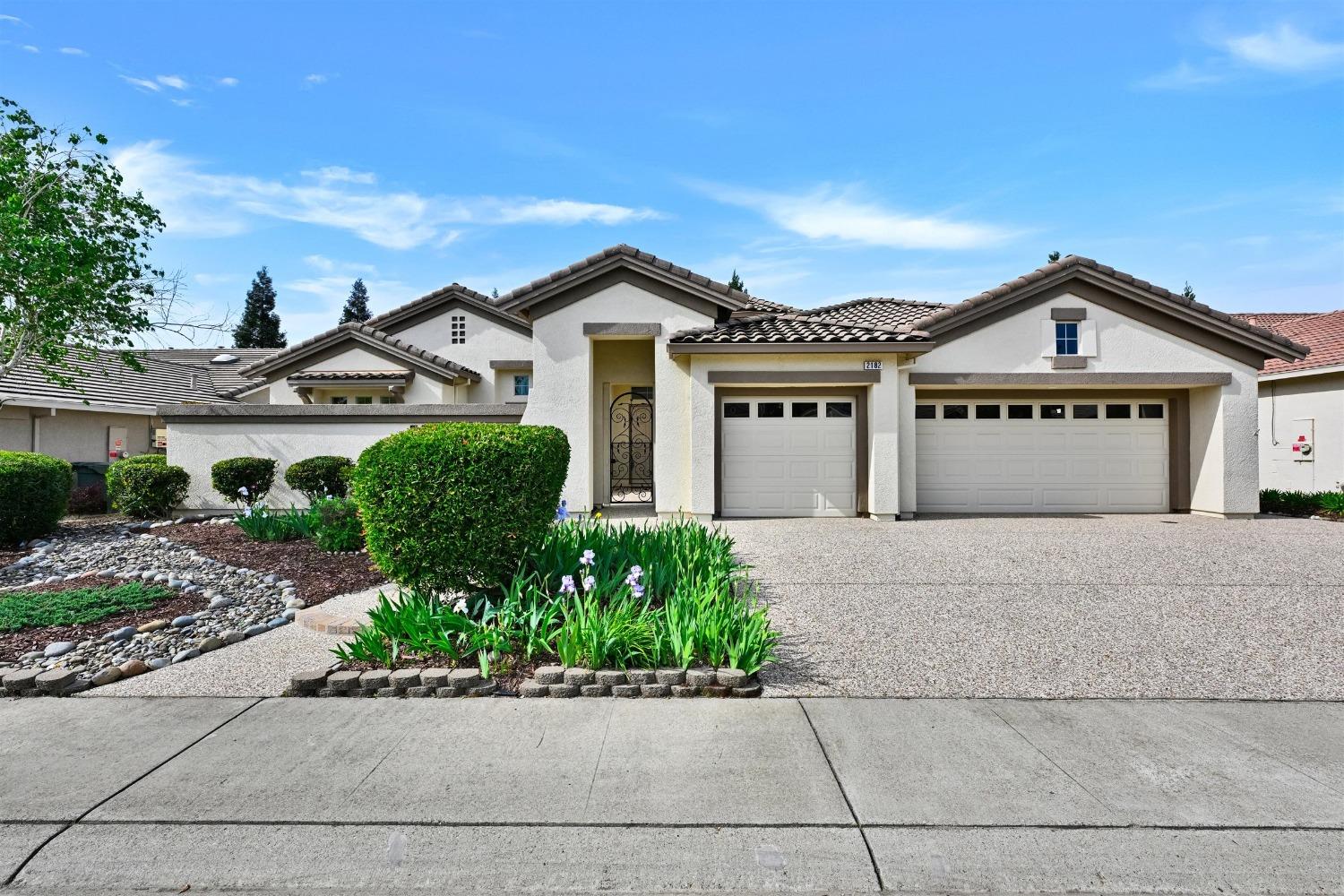 2182 Pebblestone Lane Lincoln, CA 95648 - Photo 1 of 1 a front view of a house with a garden