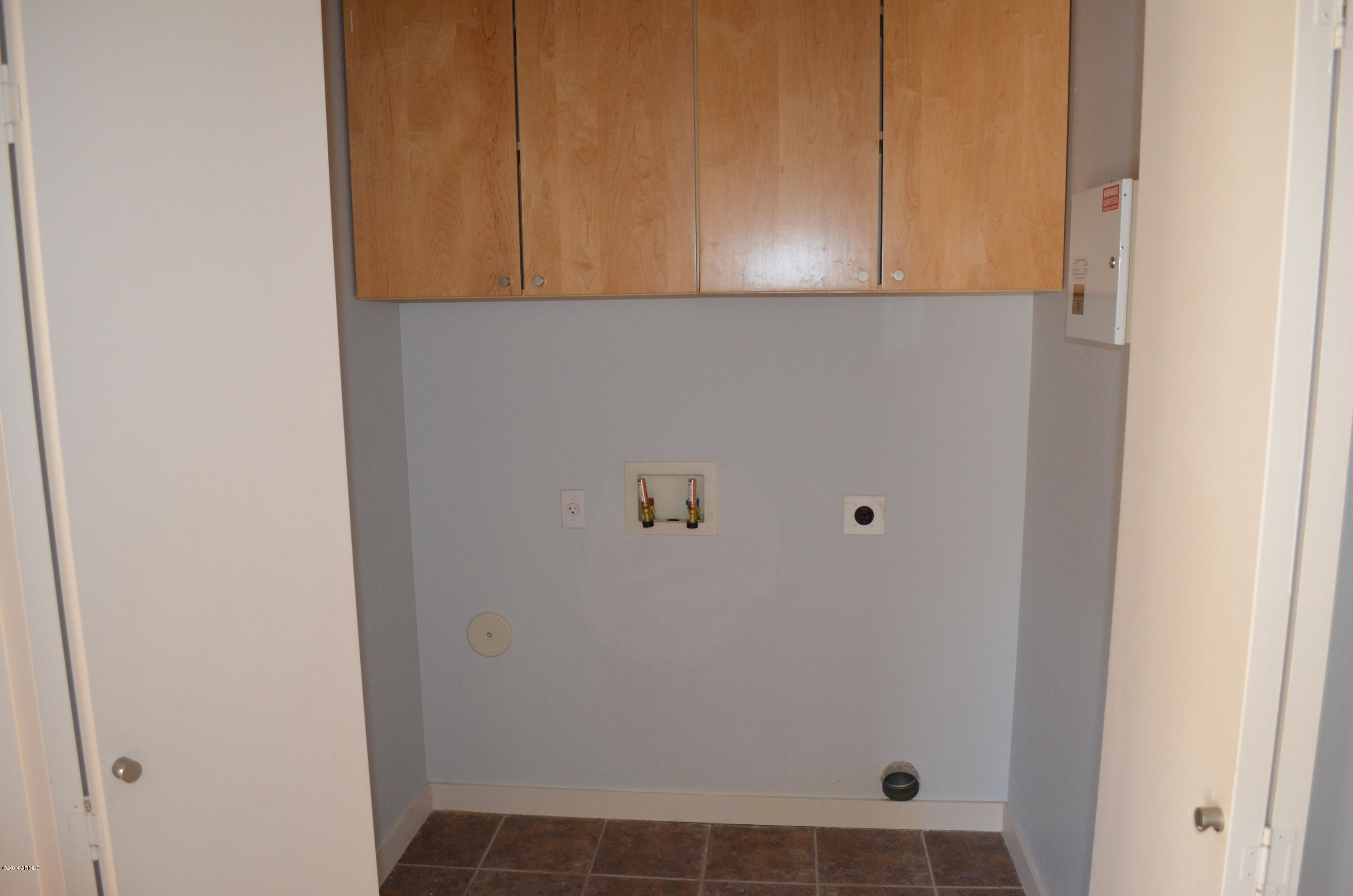 2806 East Frye Road Phoenix, AZ 85048 - Photo 20 of 24 Laundry with cabinets + security system