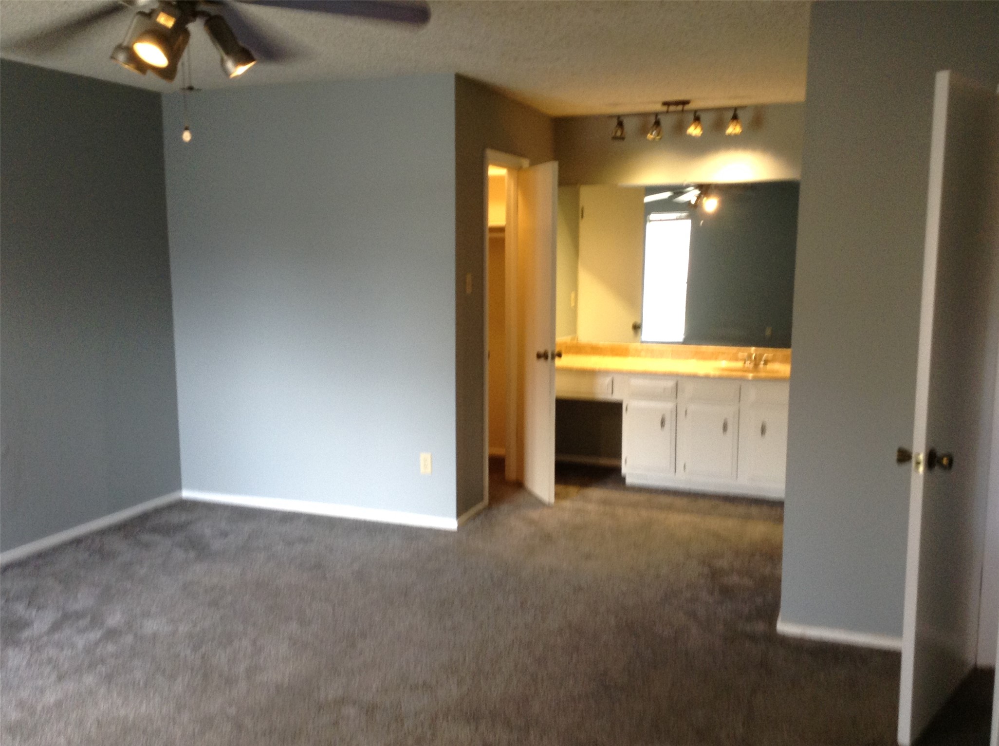 12007 Scribe Drive Austin, TX 78759 - Photo 15 of 35 a view of a bathroom with a sink and mirror