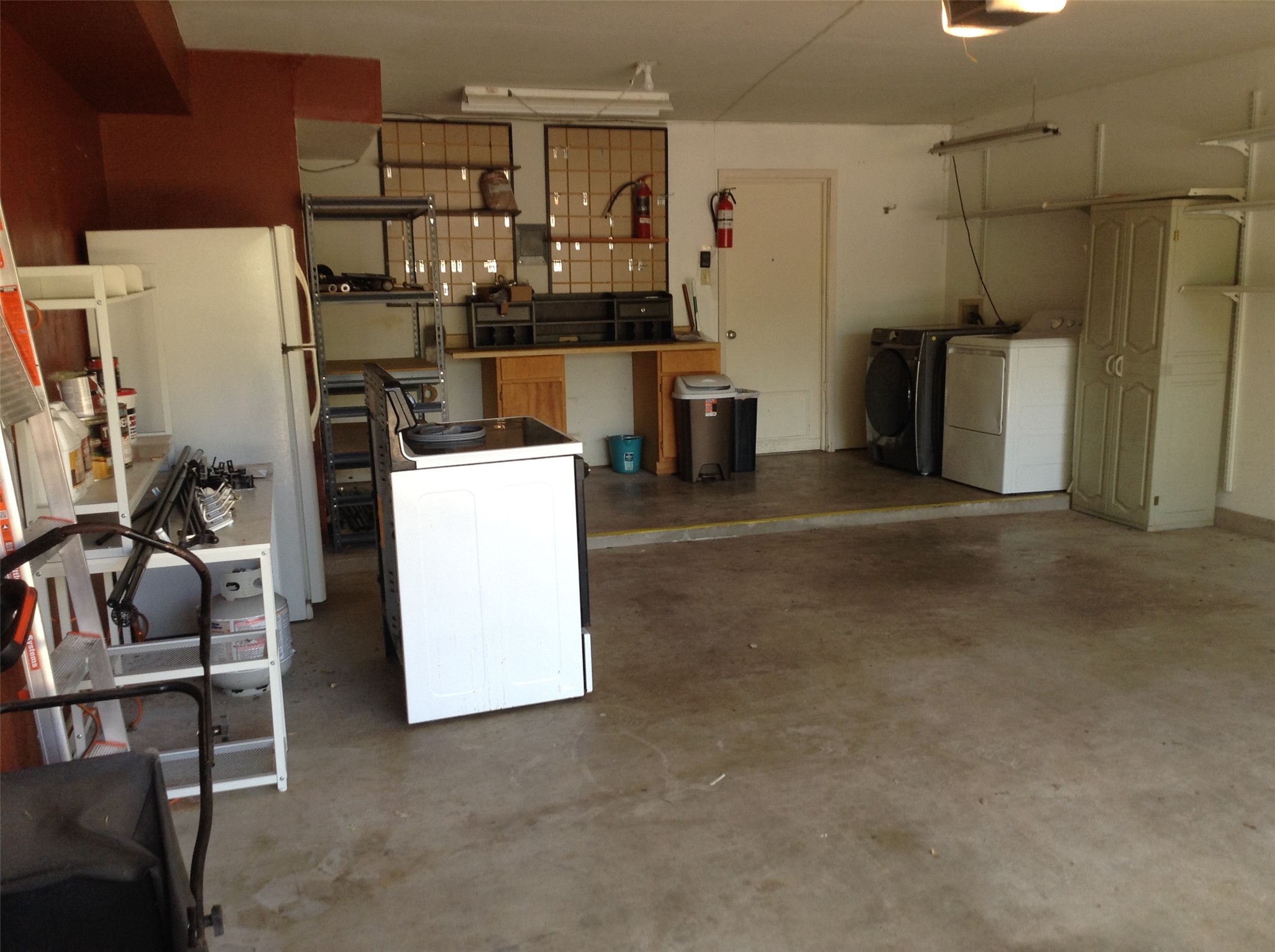 12007 Scribe Drive Austin, TX 78759 - Photo 24 of 35 a room with water heater and refrigerator