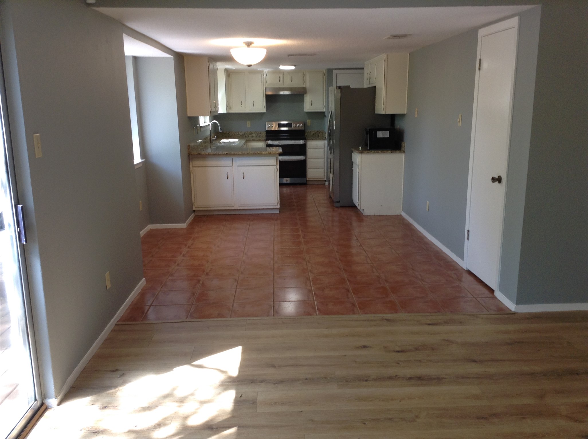 12007 Scribe Drive Austin, TX 78759 - Photo 5 of 35 a view of a kitchen from the hallway