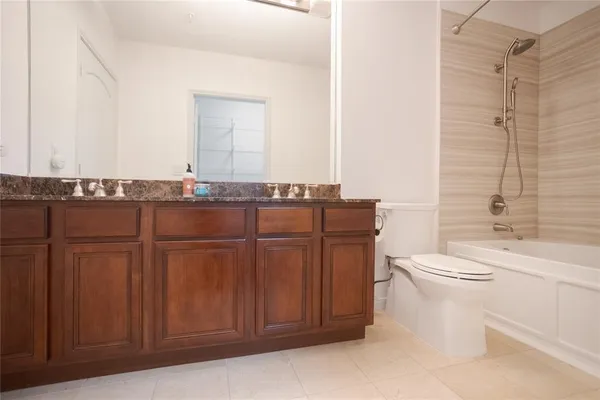 a bathroom with a toilet a sink and bathtub