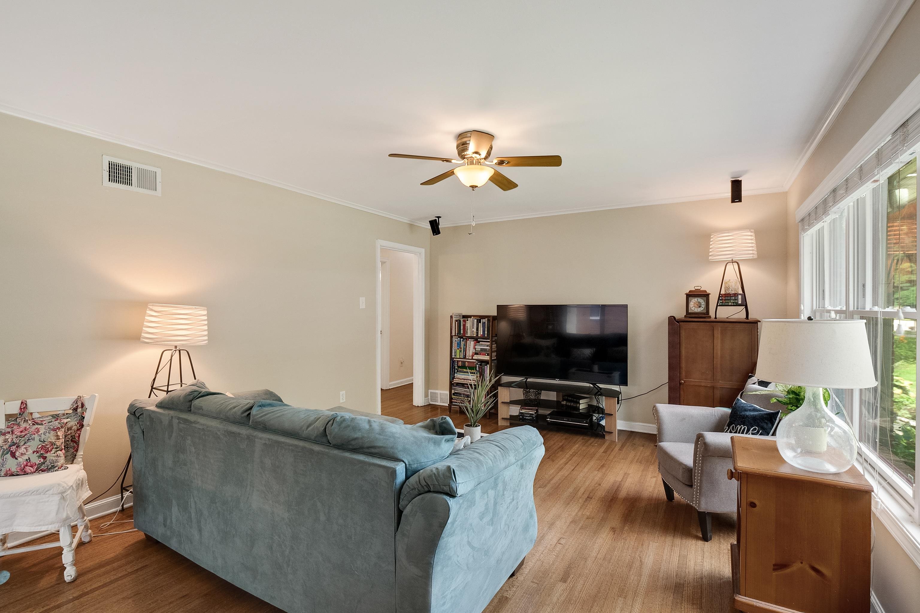 5111 Sequoia Road Memphis, TN 38117 - Photo 3 of 25 a living room with furniture and a flat screen tv