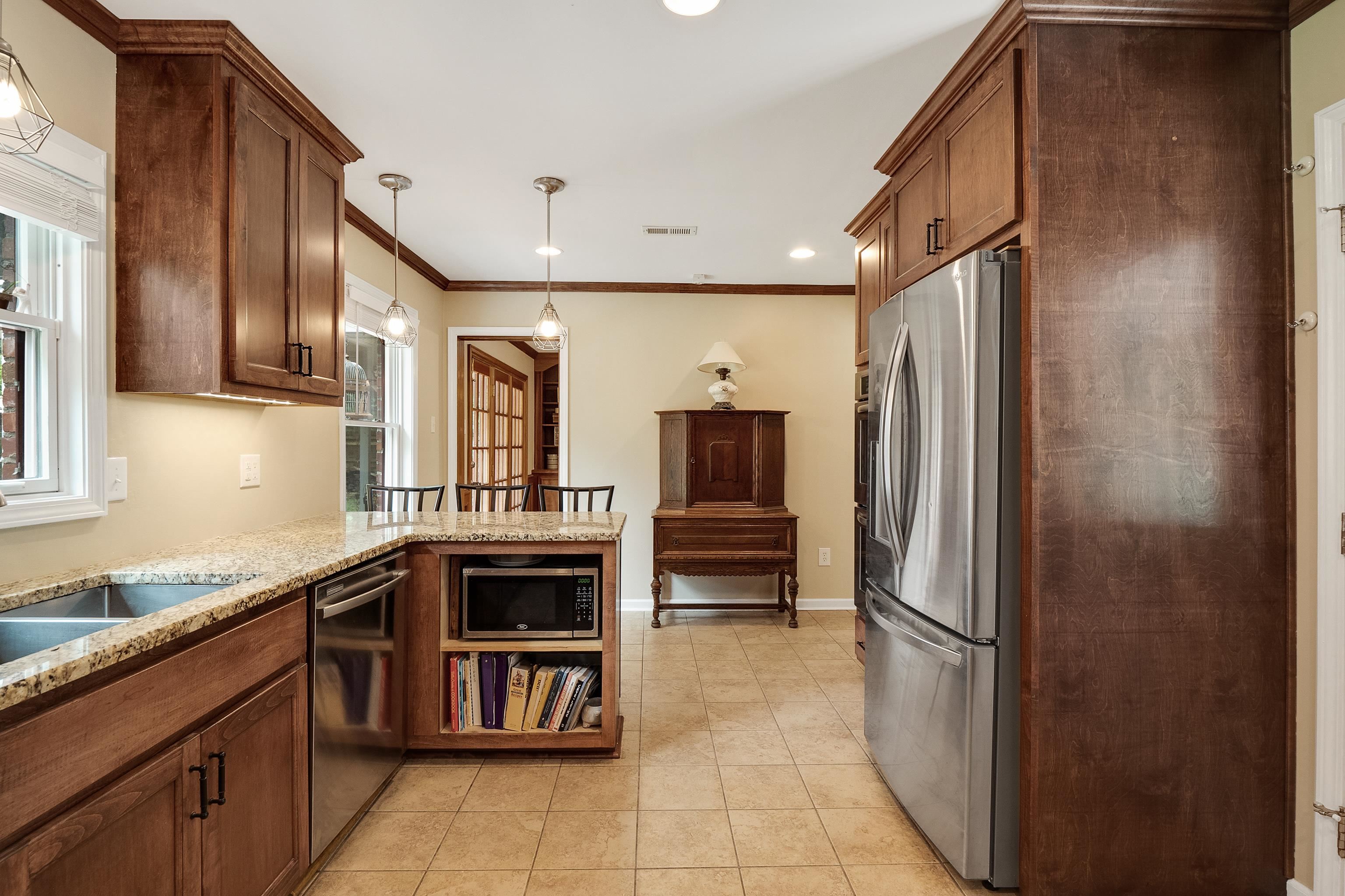 5111 Sequoia Road Memphis, TN 38117 - Photo 9 of 25 a kitchen with stainless steel appliances a refrigerator and a sink