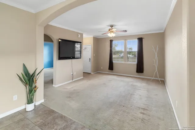 a view of a livingroom with a flat screen tv and outdoor space