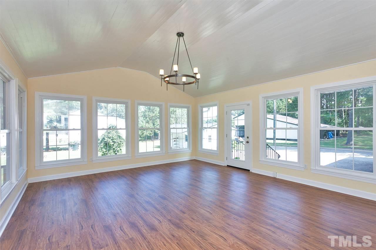 90 Johnson Town Road Zebulon, NC 27597 - Photo 11 of 18 a view of an empty room with wooden floor and a window