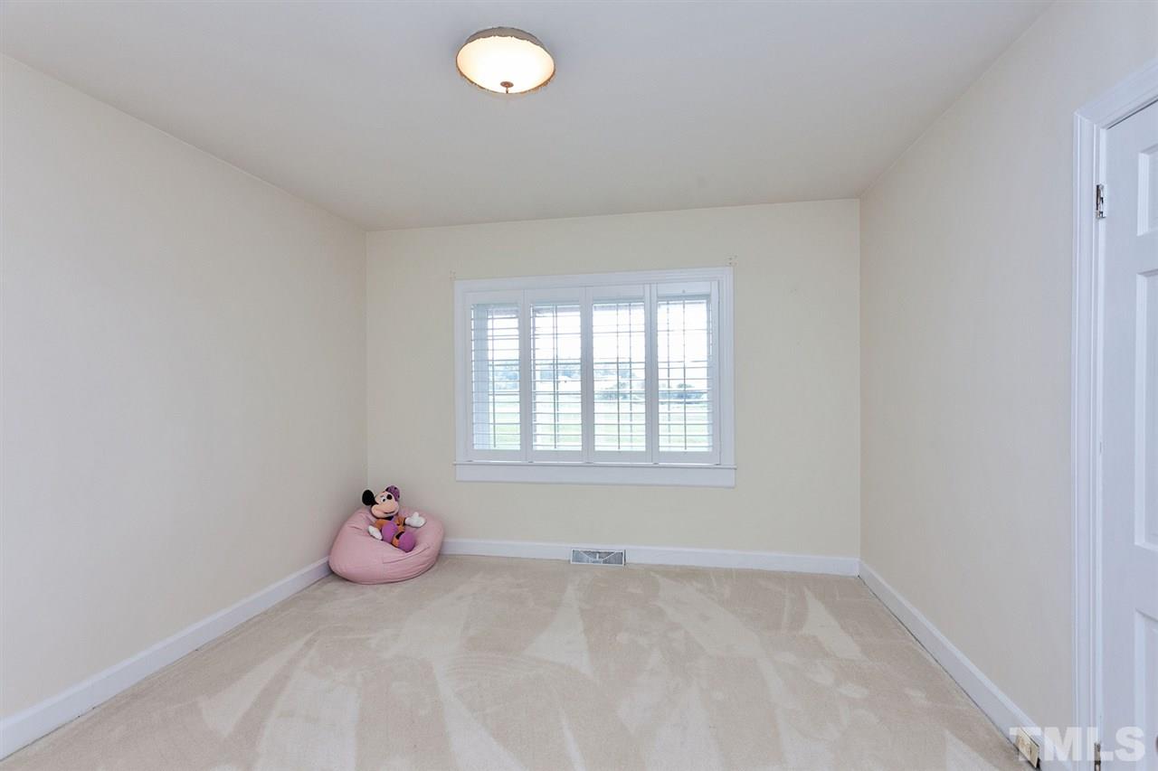 90 Johnson Town Road Zebulon, NC 27597 - Photo 15 of 18 an empty room with a window