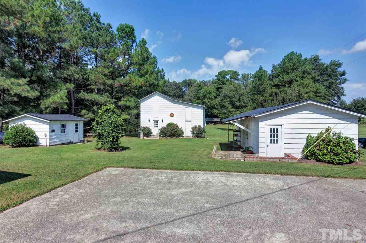 90 Johnson Town Road Zebulon, NC 27597 - Photo 18 of 18 a front view of house with yard and green space