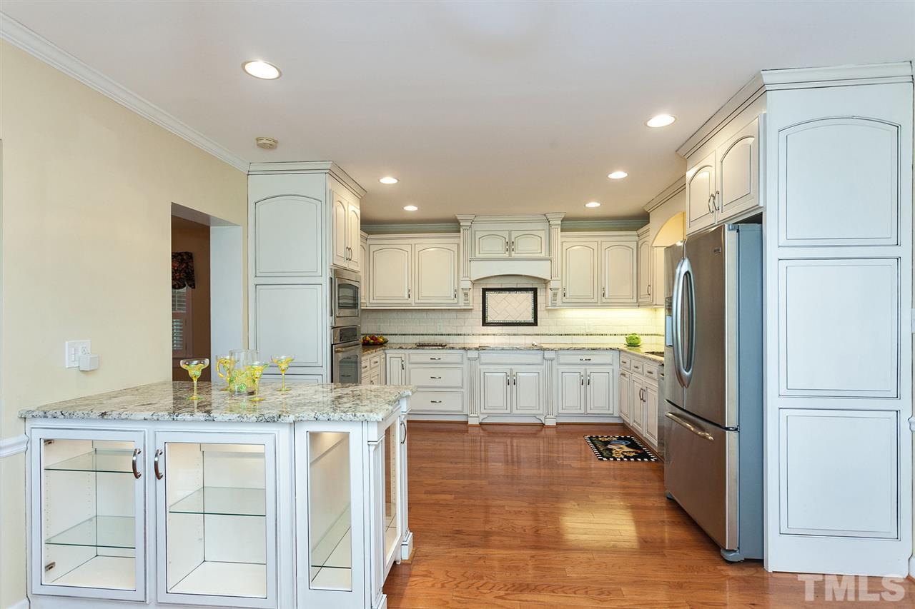 90 Johnson Town Road Zebulon, NC 27597 - Photo 6 of 18 a large kitchen with kitchen island a sink stainless steel appliances and cabinets