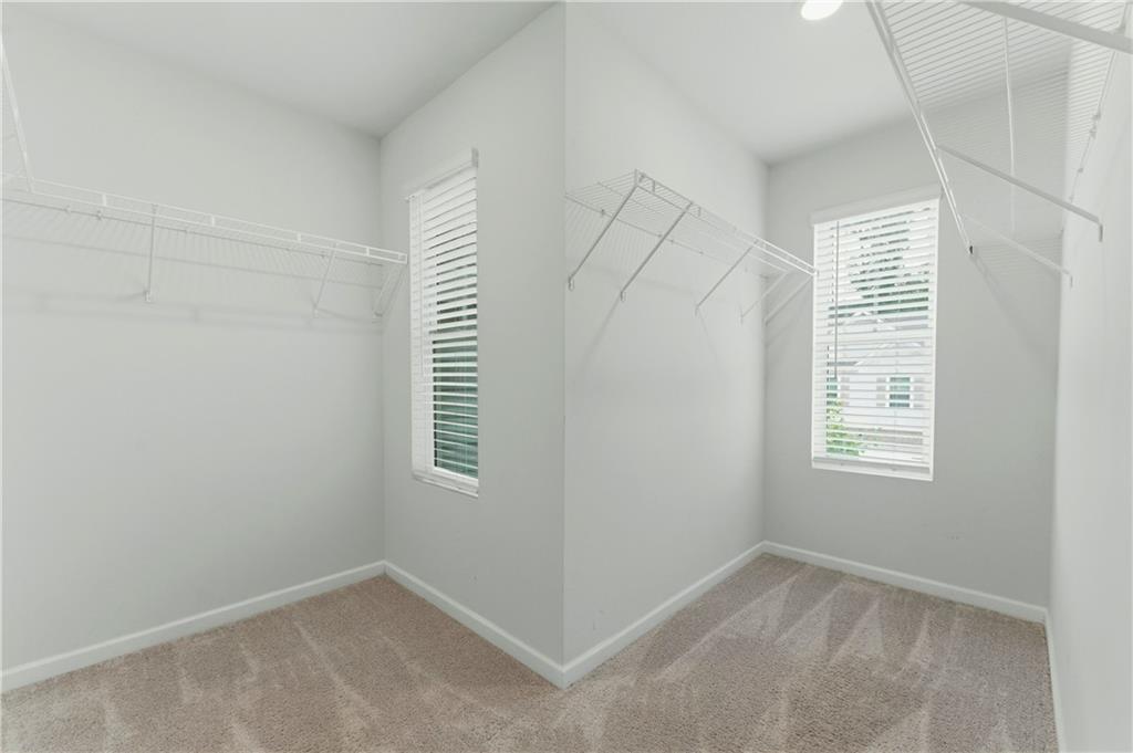 7492 Knoll Hollow Road Lithonia, GA 30058 - Photo 19 of 30 an empty room with windows