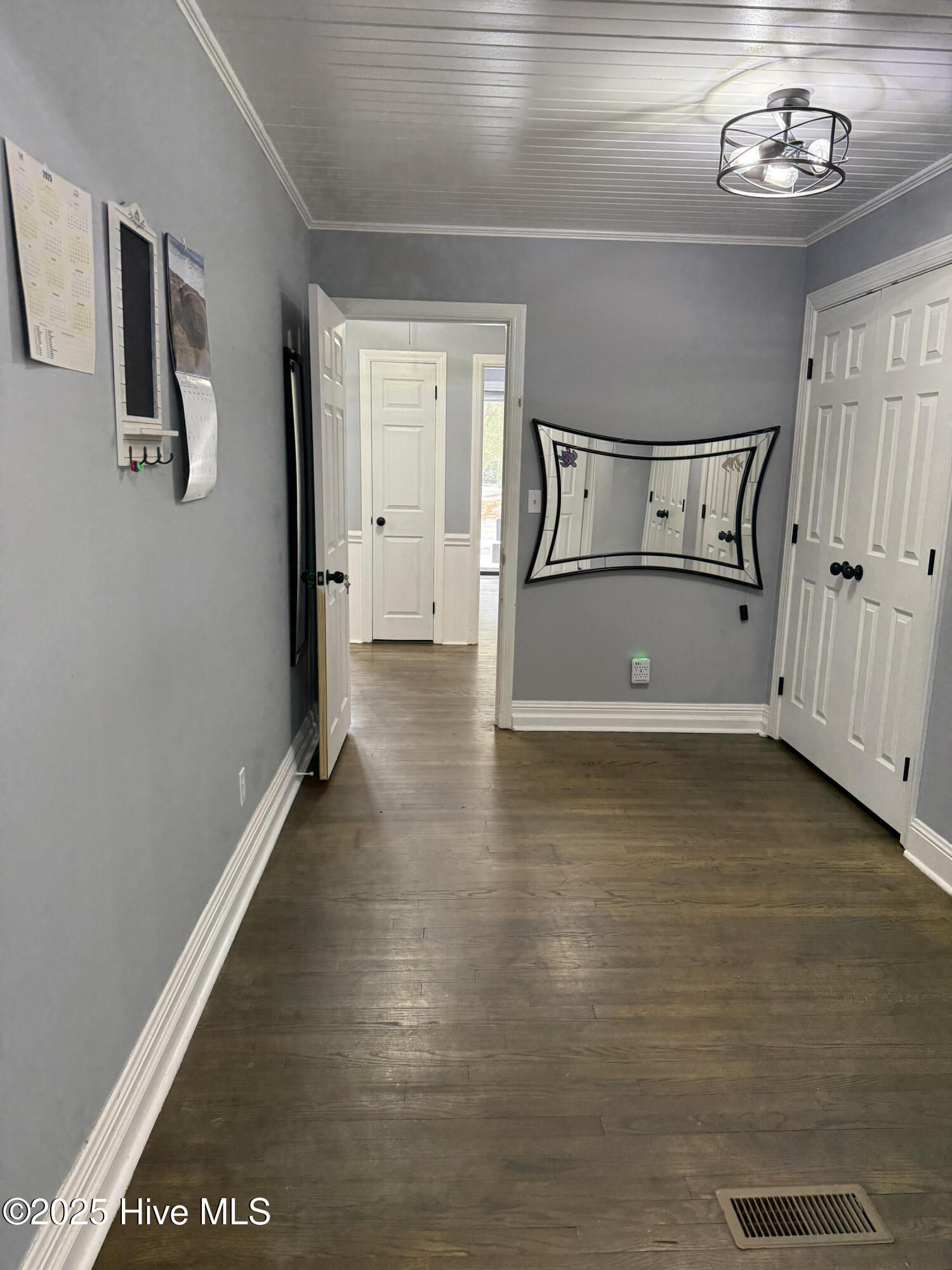 865 Pine Ridge Road Zebulon, NC 27597 - Photo 9 of 25 Transition hallway. Could be playroom or walk through library. Note the big closets could contain your laundry room!