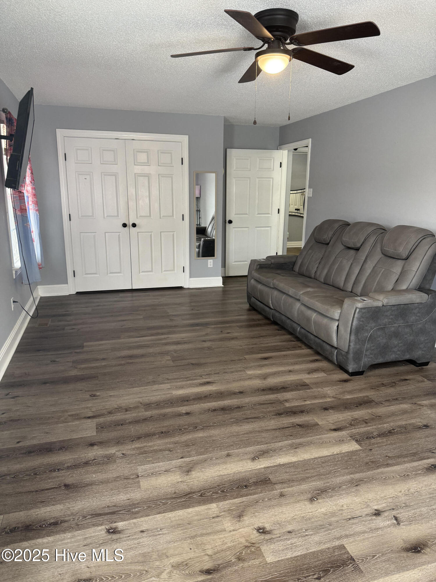 865 Pine Ridge Road Zebulon, NC 27597 - Photo 10 of 25 This room could be the primary bedroom or a huge den/plaroom combination.