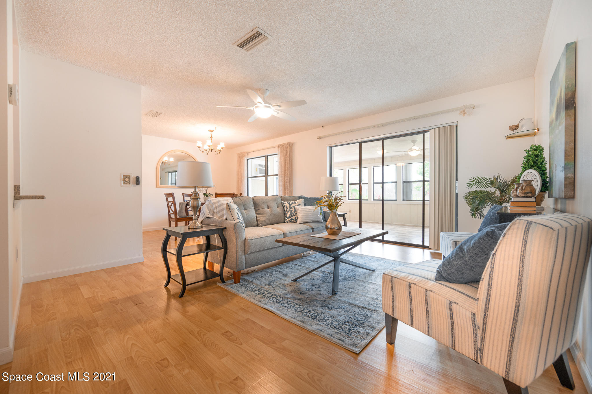 1100 Madrid Road Rockledge, FL 32955 - Photo 3 of 29 a living room with furniture and a large window