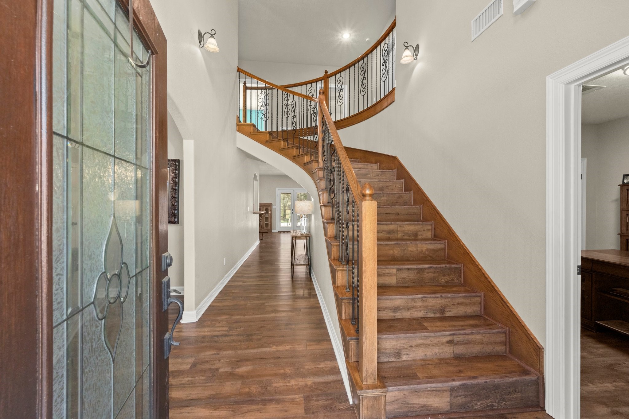825 Walding Road Livingston, TX 77351 - Photo 12 of 50 a view of staircase with lots of frames on wall and wooden floor