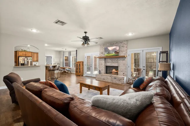 a kitchen with stainless steel appliances granite countertop a stove and a refrigerator