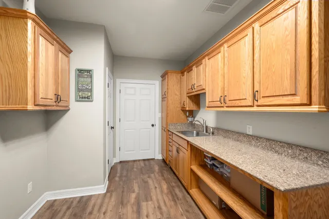 a kitchen with a refrigerator and window