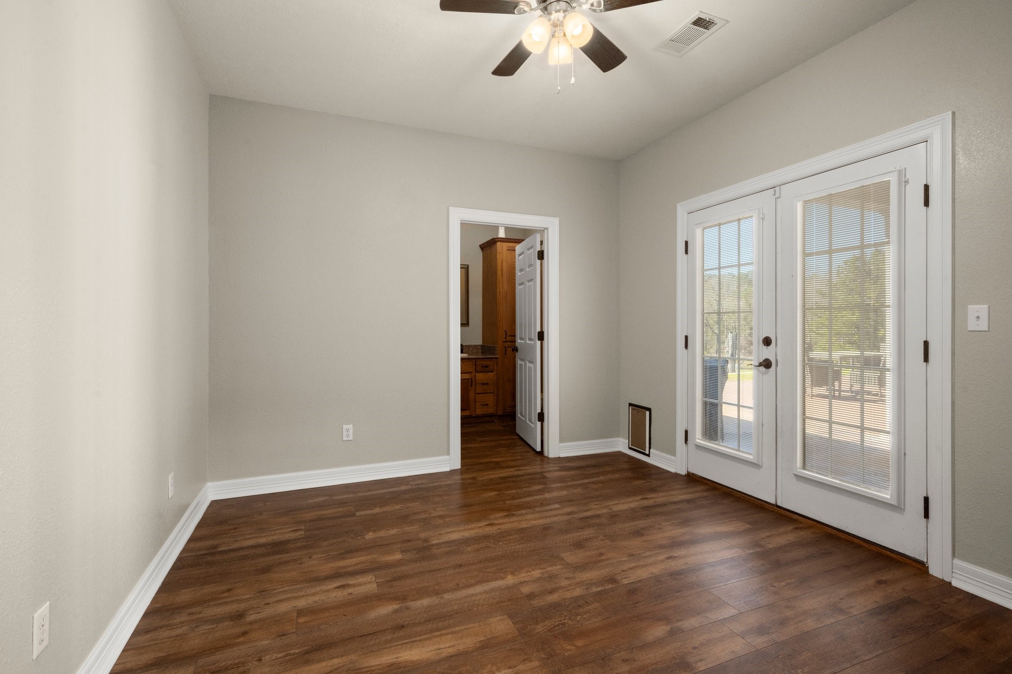 825 Walding Road Livingston, TX 77351 - Photo 31 of 50 an empty room with wooden floor and entryway