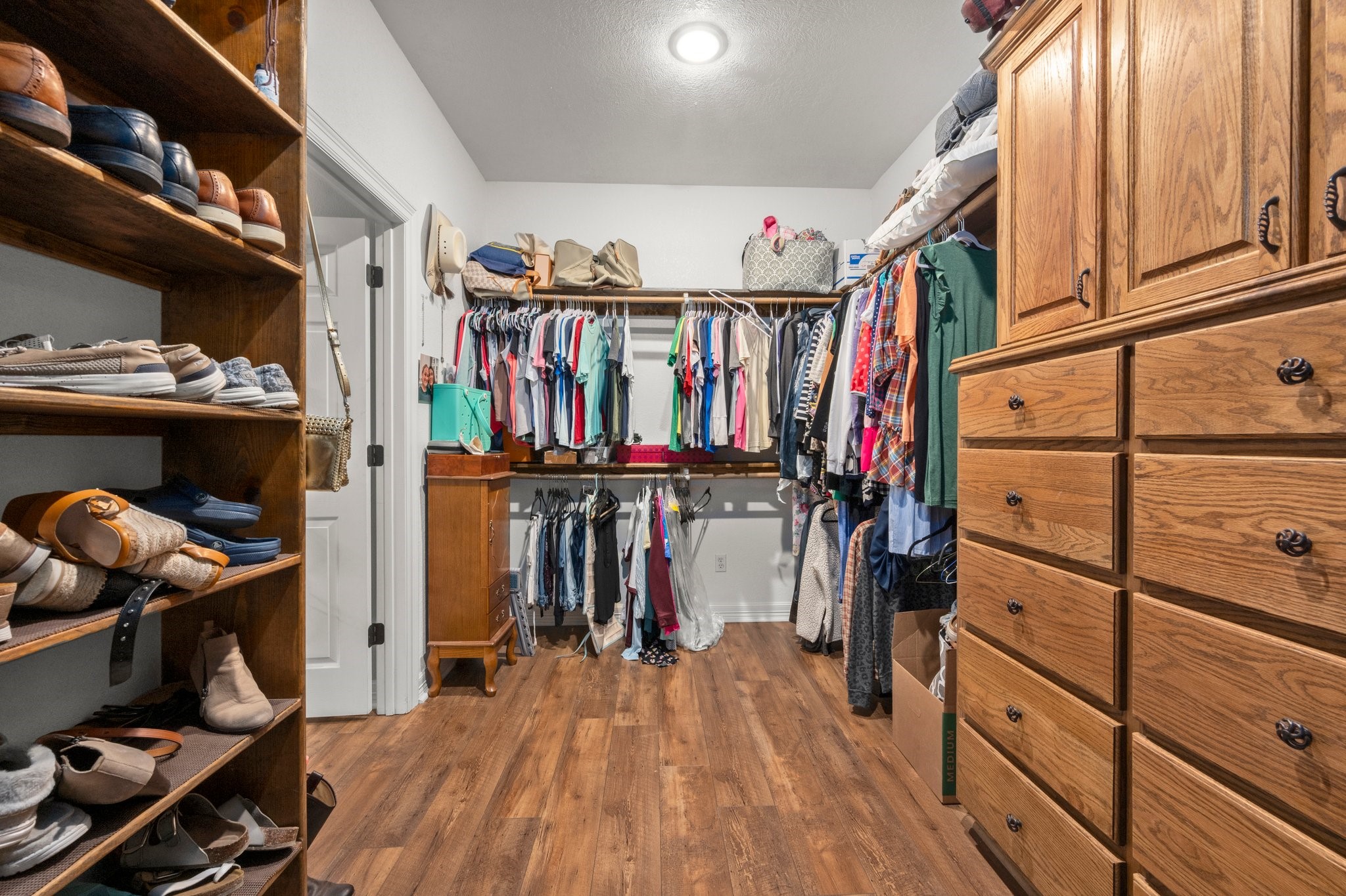 825 Walding Road Livingston, TX 77351 - Photo 40 of 50 a view of walk in closet with clothes and shoes