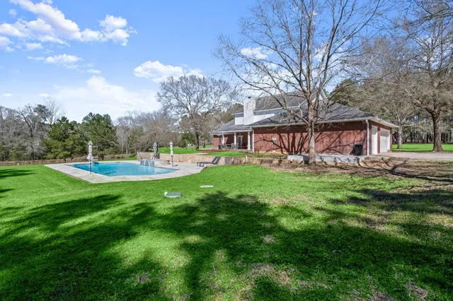 a view of a house with a yard porch and sitting area