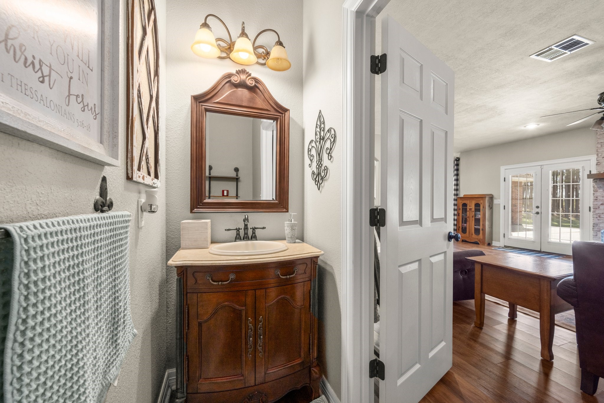 825 Walding Road Livingston, TX 77351 - Photo 41 of 50 a bathroom with a sink a mirror and a shower