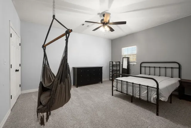 a bathroom with double vanity sinks and a mirror