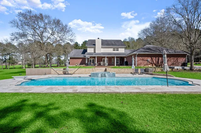 a front view of building with yard and green space