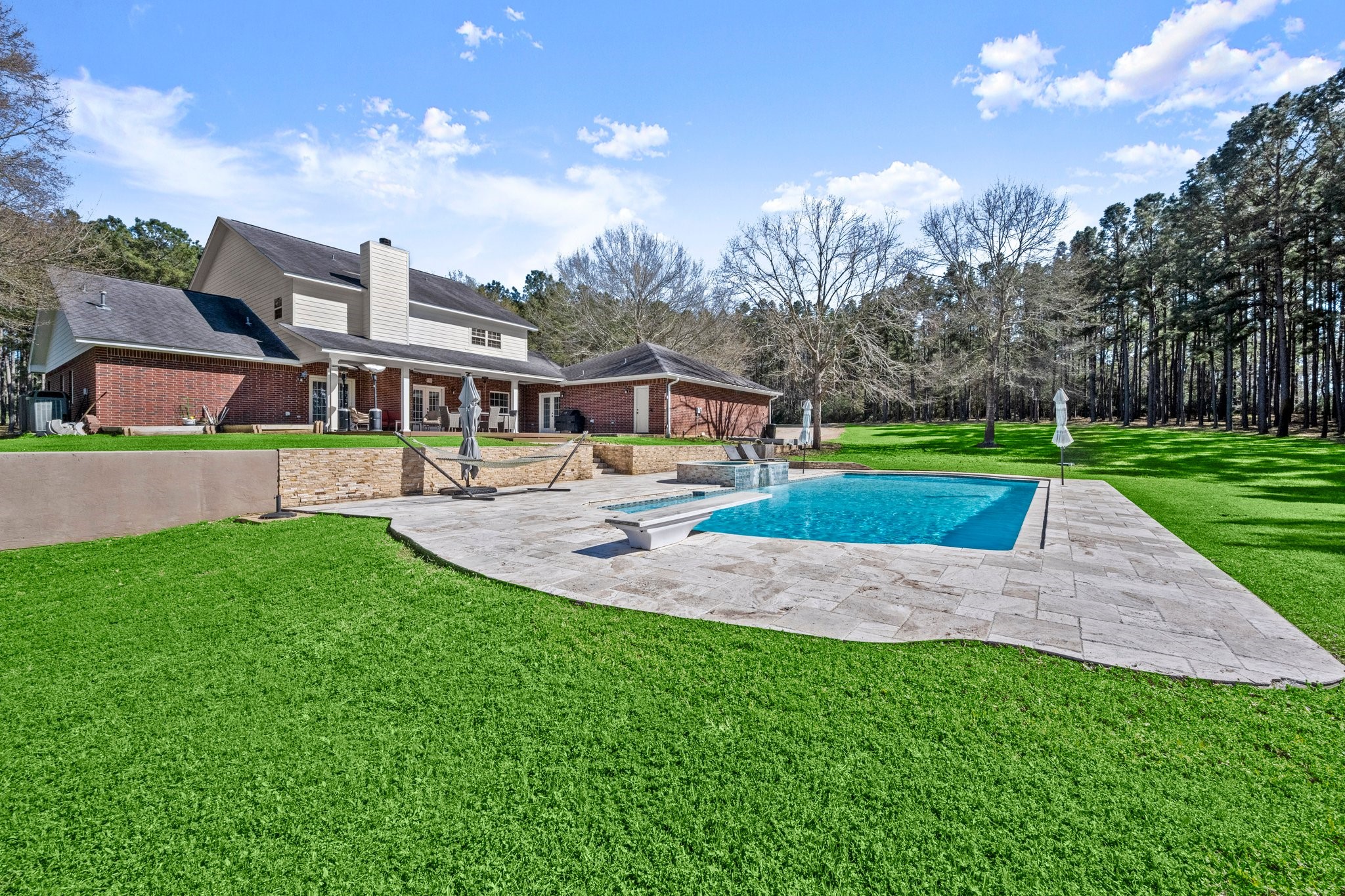 825 Walding Road Livingston, TX 77351 - Photo 8 of 50 a view of an house with swimming pool and yard