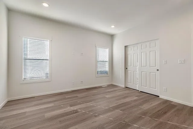 a bathroom with double sink and a mirror