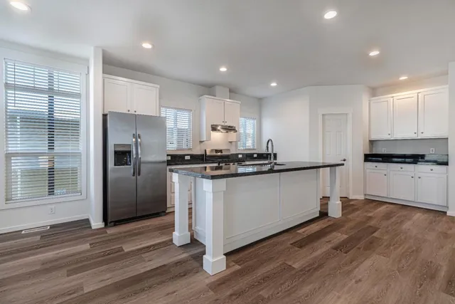 a view of kitchen with wooden floor