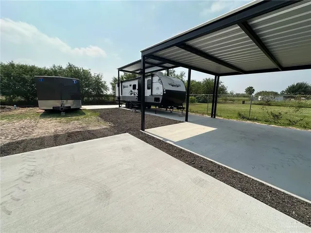 a view of a backyard with sitting area