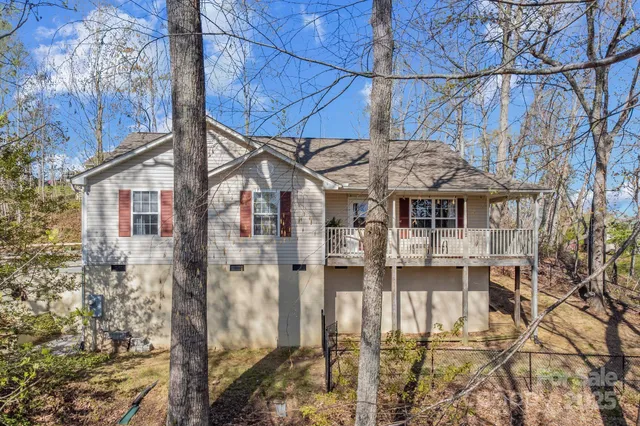 a aerial view of a house with a yard