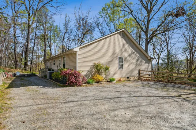 a view of a house with a yard and garage