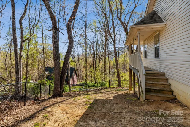 a view of a park with iron fence