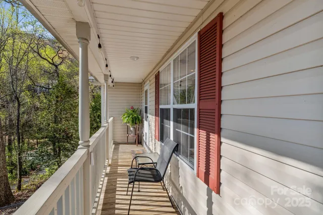a view of balcony with furniture