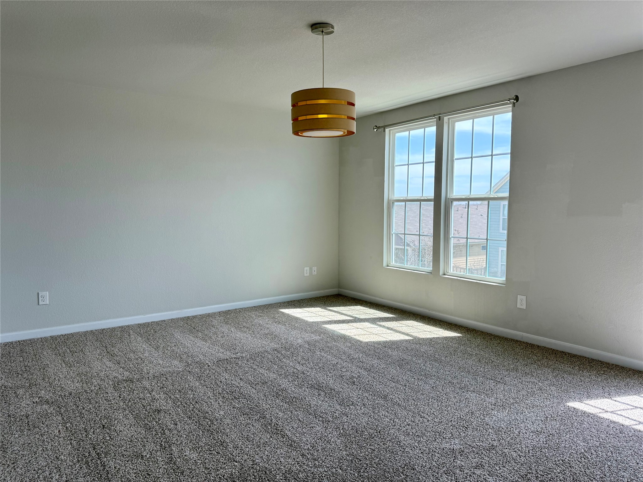 1293 Nevarez Kyle, TX 78640 - Photo 11 of 31 Carpeted empty room featuring baseboards.