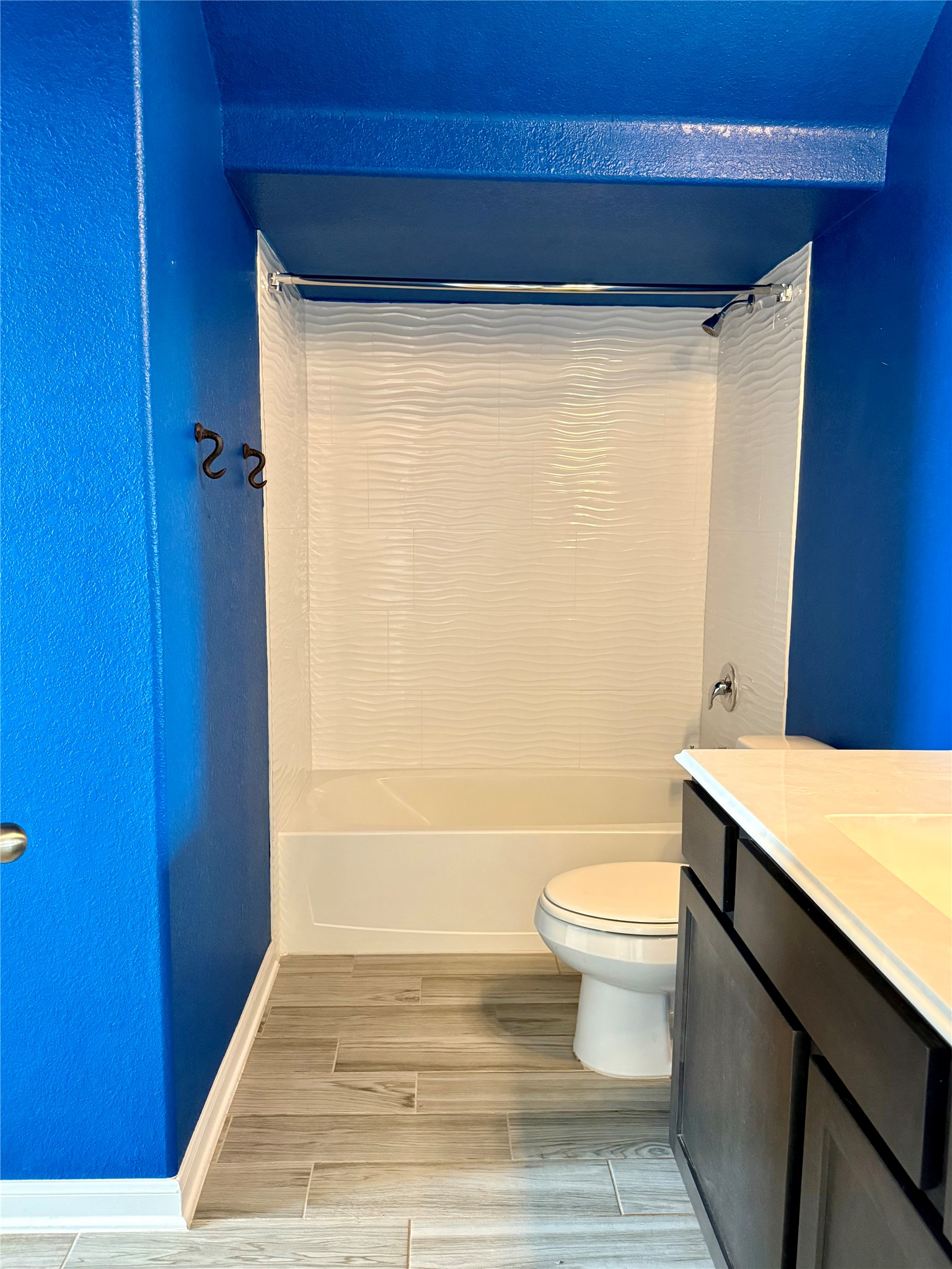 1293 Nevarez Kyle, TX 78640 - Photo 20 of 31 Another Full bath with toilet, wood tiled floor, shower / tub combination, baseboards, and vanity